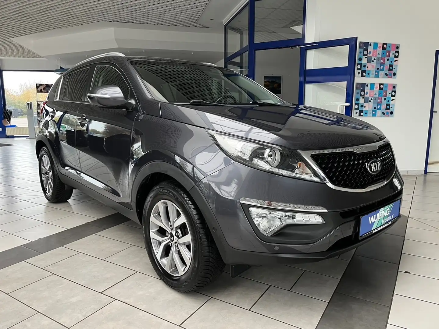 Kia Sportage 1.6 GDI Dream,Pan.Dach,Navi,AHK,SPAS, Grau - 1
