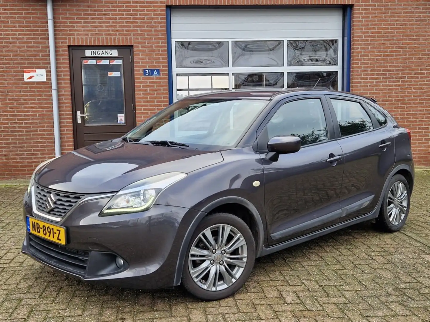 Suzuki Baleno 1.2 Exclusive 5-drs Airco NL-auto trekhaak Stoelve Gris - 1