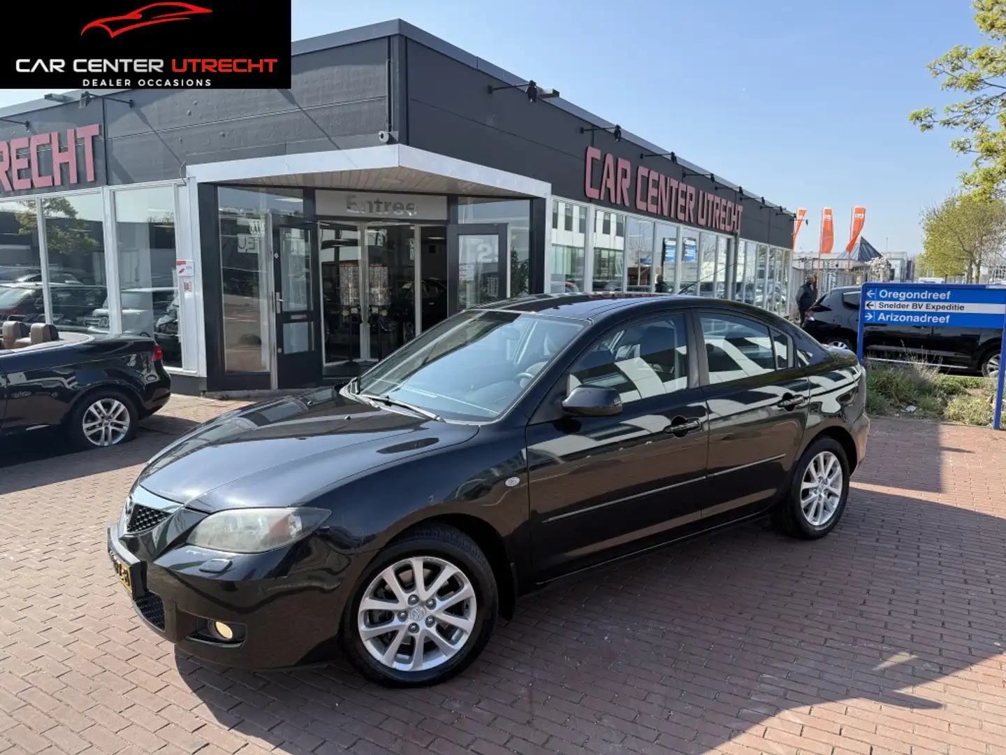 Mazda 3 2.0 DiSi TS Plus | navi | automaat | 4 deurs | Zwart - 1
