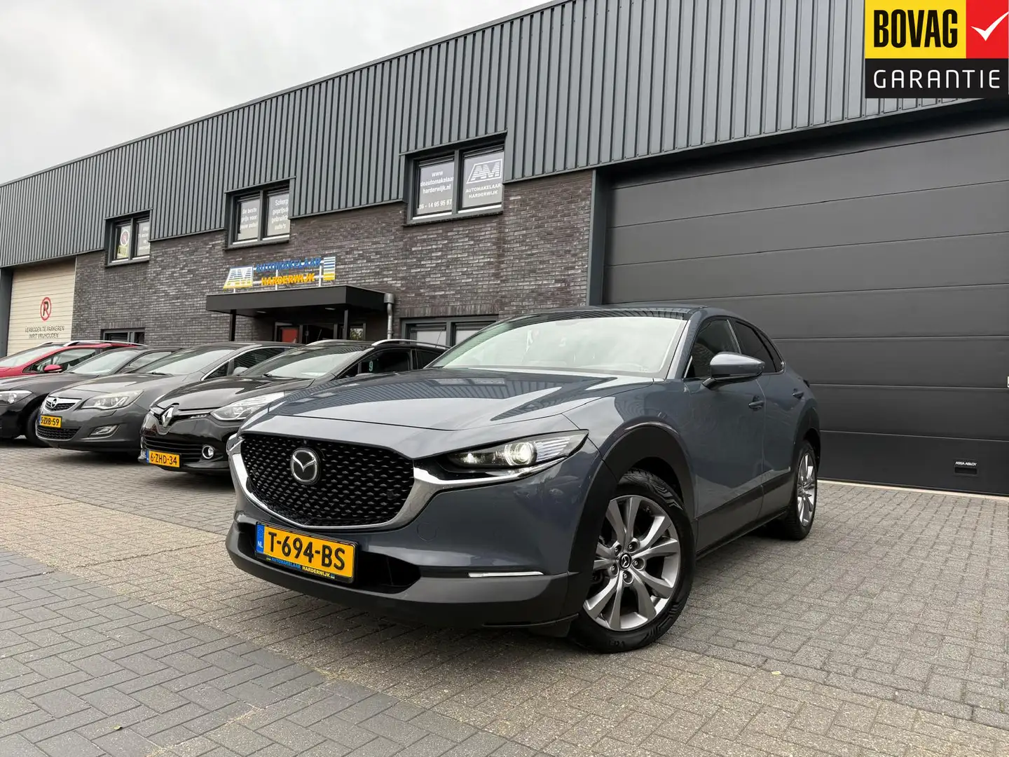 Mazda CX-30 2.0 e-SkyActiv-G M Hybrid | 1E EIGENAAR | 12MND GA Grau - 1