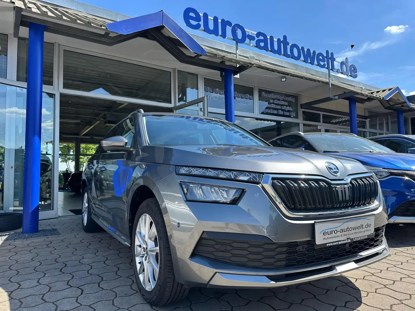 Skoda Kamiq 1.0 DSG Style *App *el.Hk *AHK *PDC+Kam. Grijs - 1
