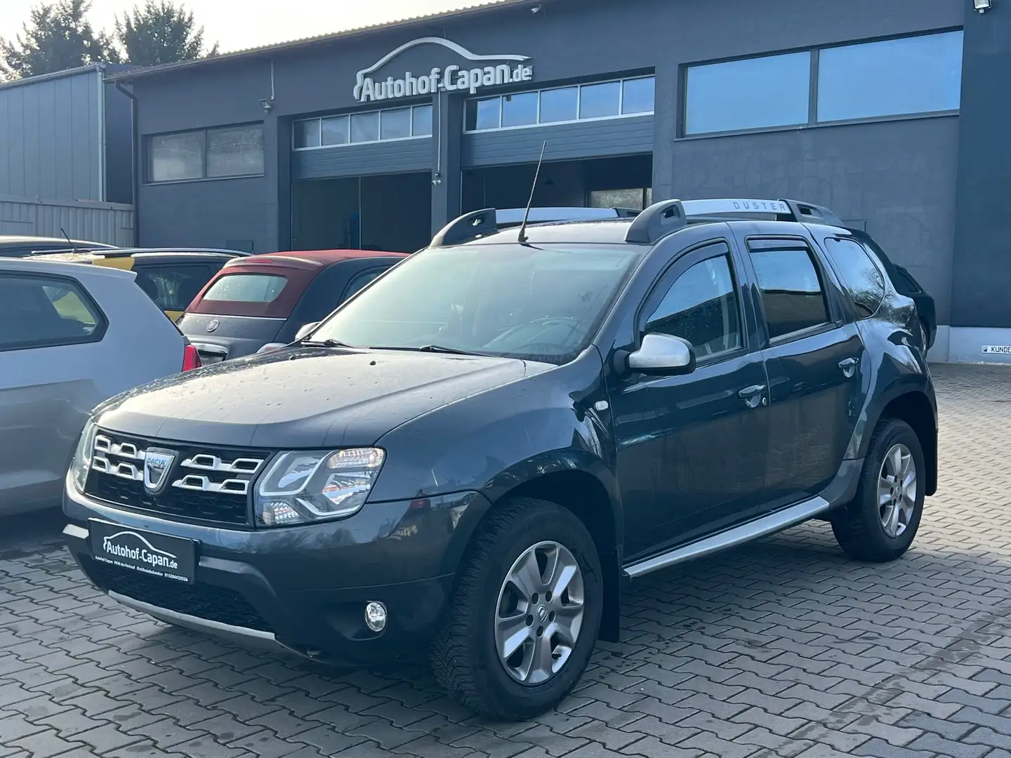 Dacia Duster DusterI Prestige 4x2/AHK/Leder/Navi/Eu6/TUV 06.26 Grau - 1
