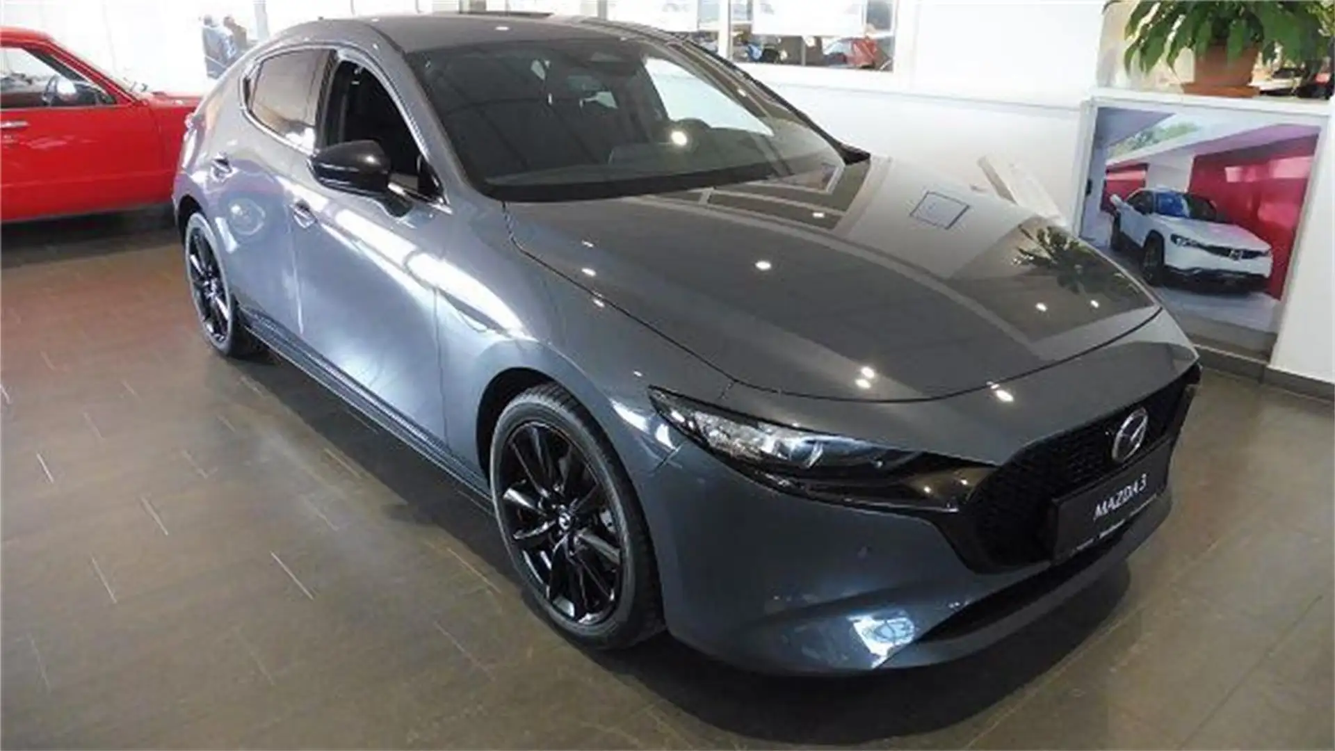 Mazda 3 2025 2.5L e-SKYACTIV G 140ps 6MT 2WD HOMURA Grau - 1