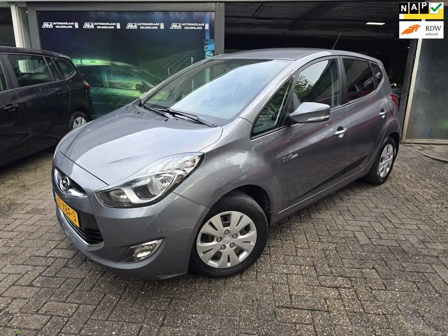Hyundai iX20 1.6i i-Motion | 2E EIGENAAR | 12MND GARANTIE | NW Grijs - 1