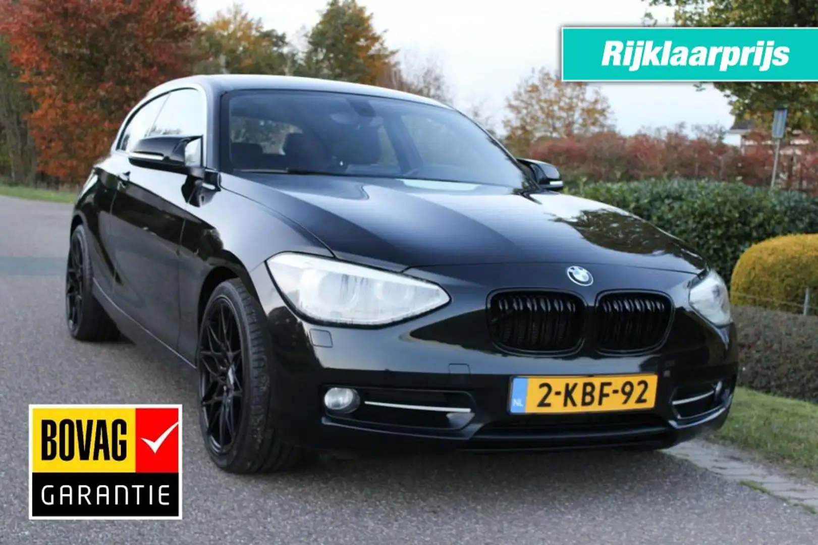 BMW 114 114i 1.6i 102pk Business+ ECC/cruise/leer/navi/PDC Zwart - 1