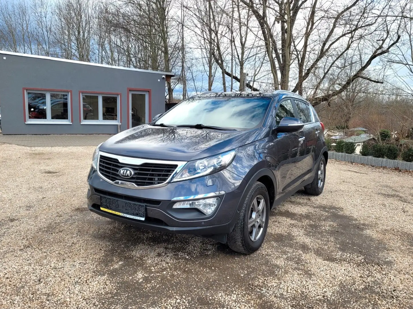 Kia Sportage Spirit 4WD*Pano*R-Cam*4xSZH*Navi*AHK*HU Grau - 1