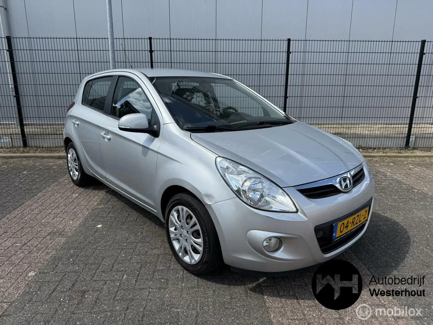 Hyundai i20 1.2i i-Motion Airco Nieuwe APK Grijs - 1
