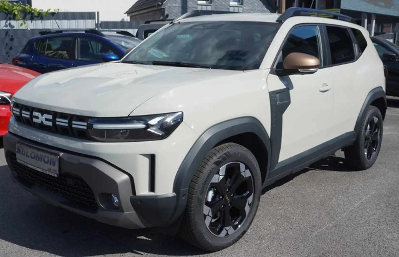 Dacia Duster III TCe150AUTOM*Extr+AHK NAVI+4 CAM+18Zoll Beige - 1