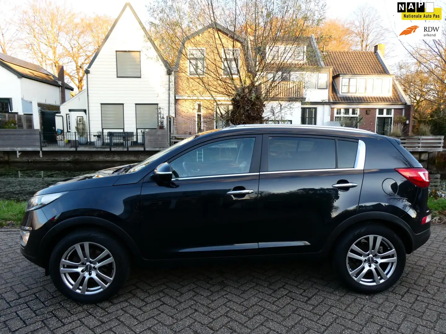 Kia Sportage 2.0 X-ecutive Plus Pack 163pk Clima Cruise Trekhaa Zwart - 1