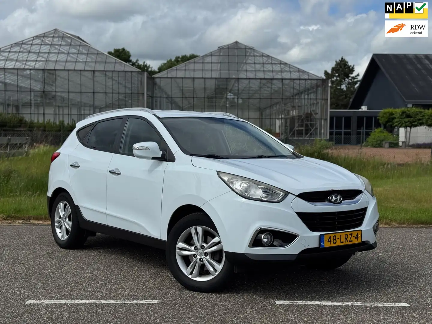 Hyundai iX35 2.0i Style Airco | Cruise | Climate | Trekhaak | A Weiß - 1