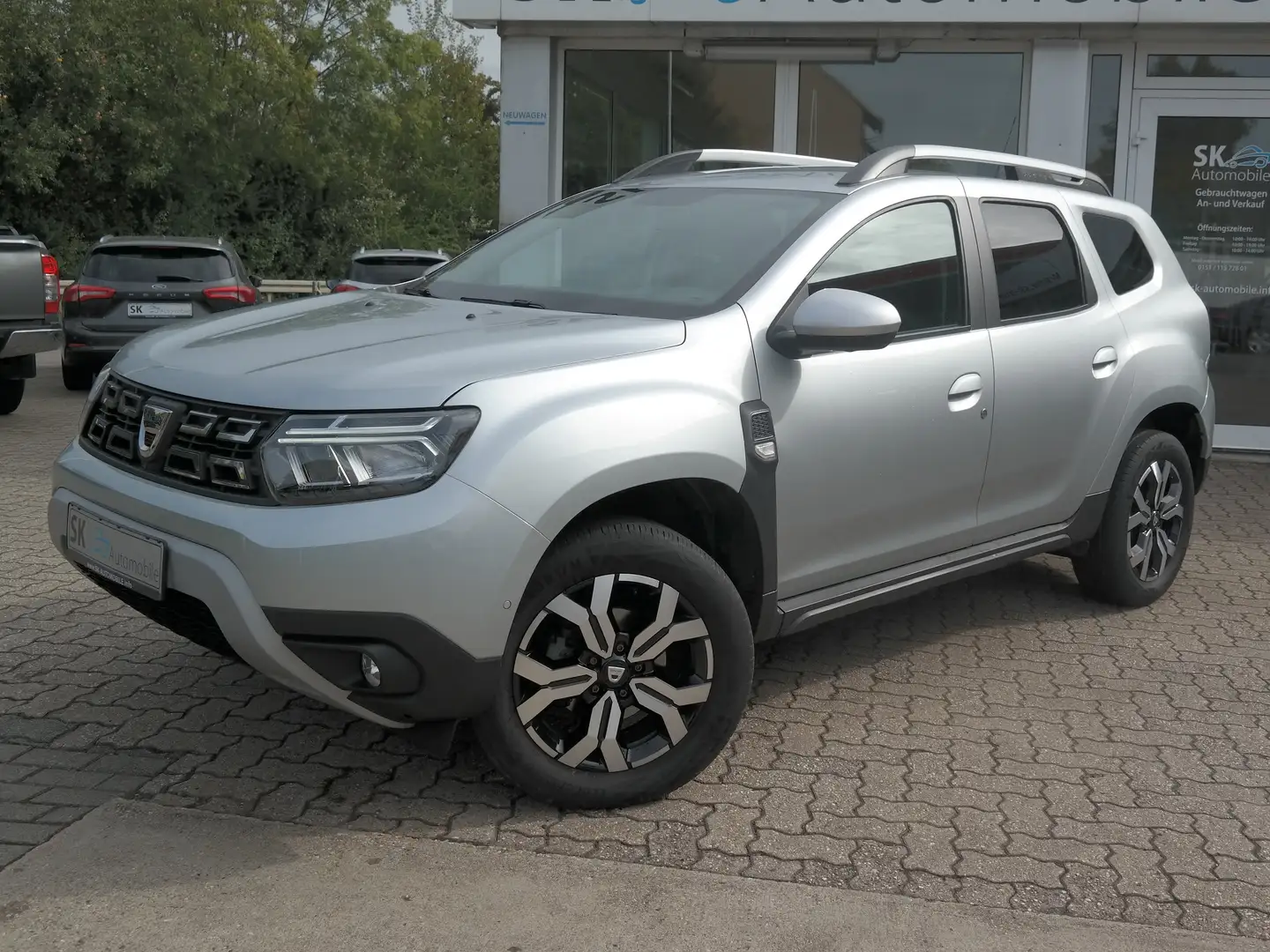 Dacia Duster Prestige+*1.Hand*LPG-AUTOGAS*NAVI*SHZ*R-CAM Silber - 1