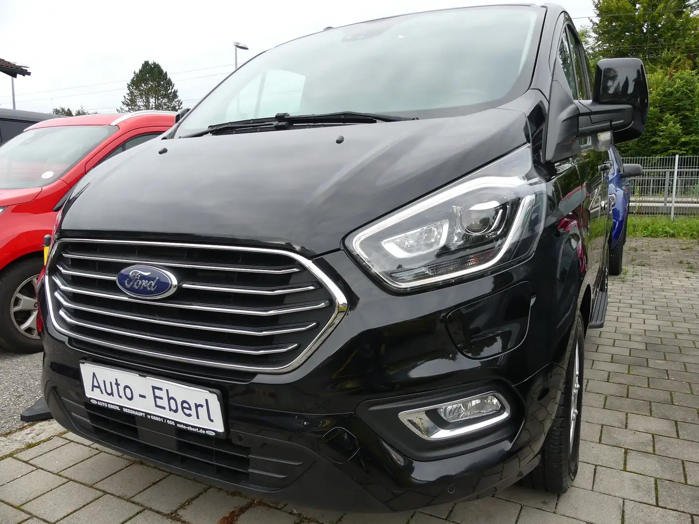 Ford Tourneo Custom 34'km!  PHEV 8-Sitzer/Leder/Xenon/RFK/Titanium Schwarz - 1