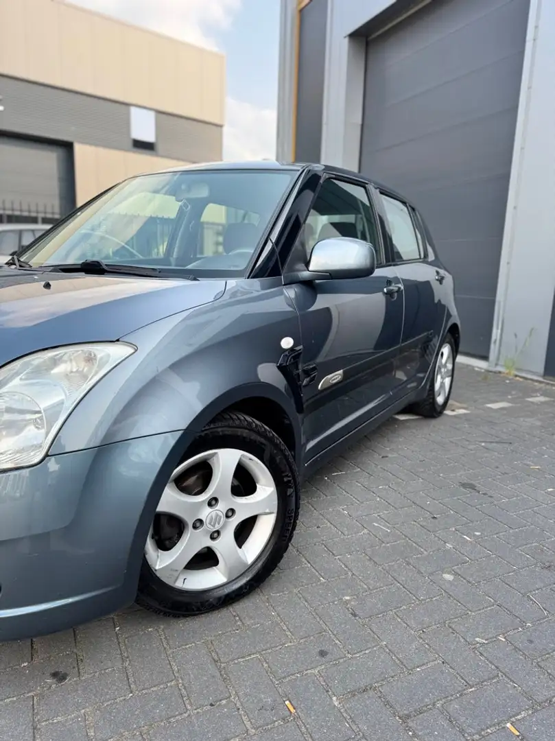 Suzuki Swift 1.3 Shogun Grijs - 1