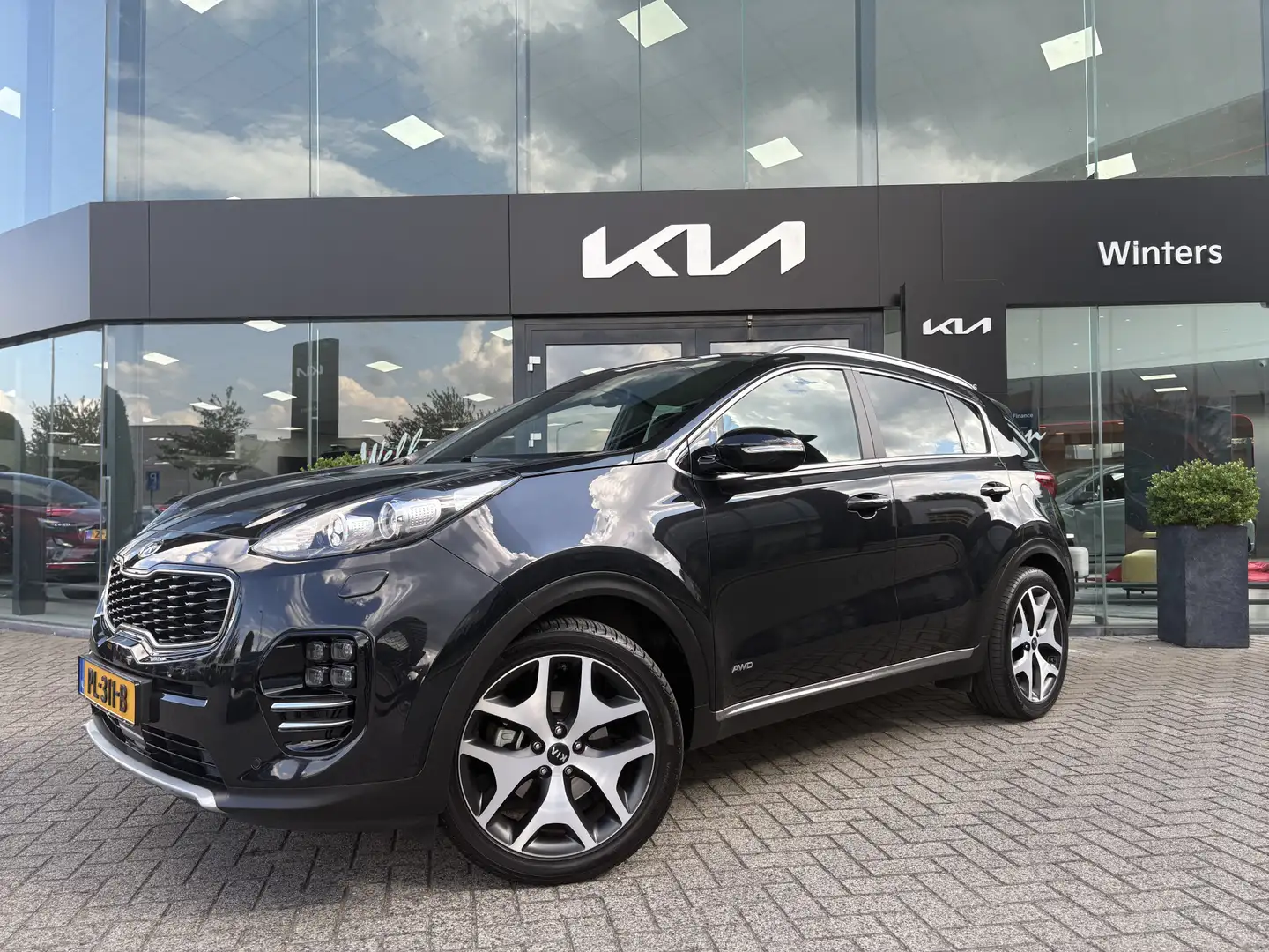 Kia Sportage 1.6 T-GDI 4WD GT-PlusLine Automaat | Trekhaak |  J Zwart - 1