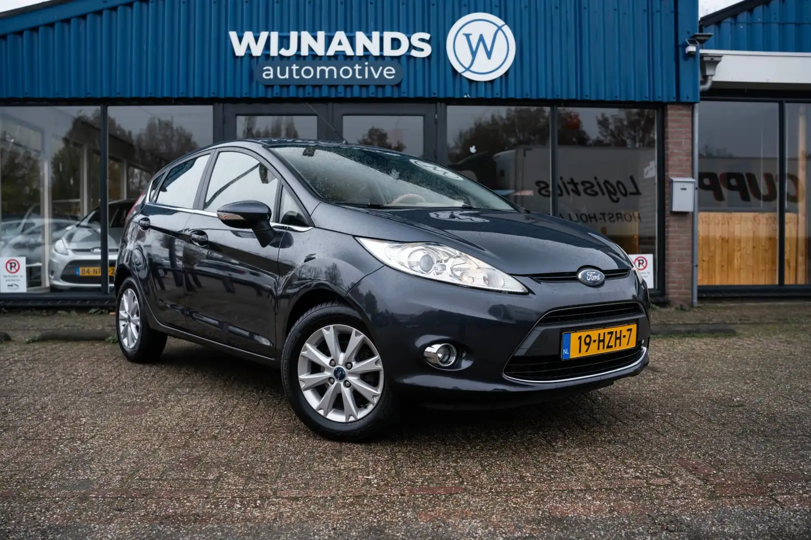 Ford Fiesta 1.25 Titanium Cruise Clima Lichtmetaal BT Parkse Gris - 1