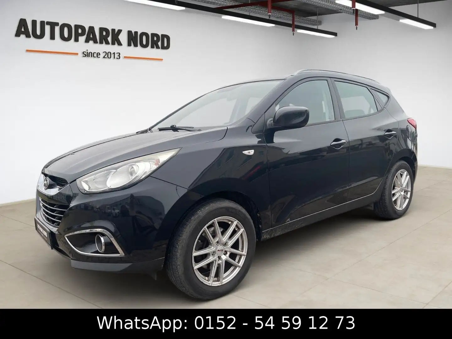 Hyundai iX35 2.0l Comfort 2WD/AHK/SHZ/PDC/ALU Schwarz - 1