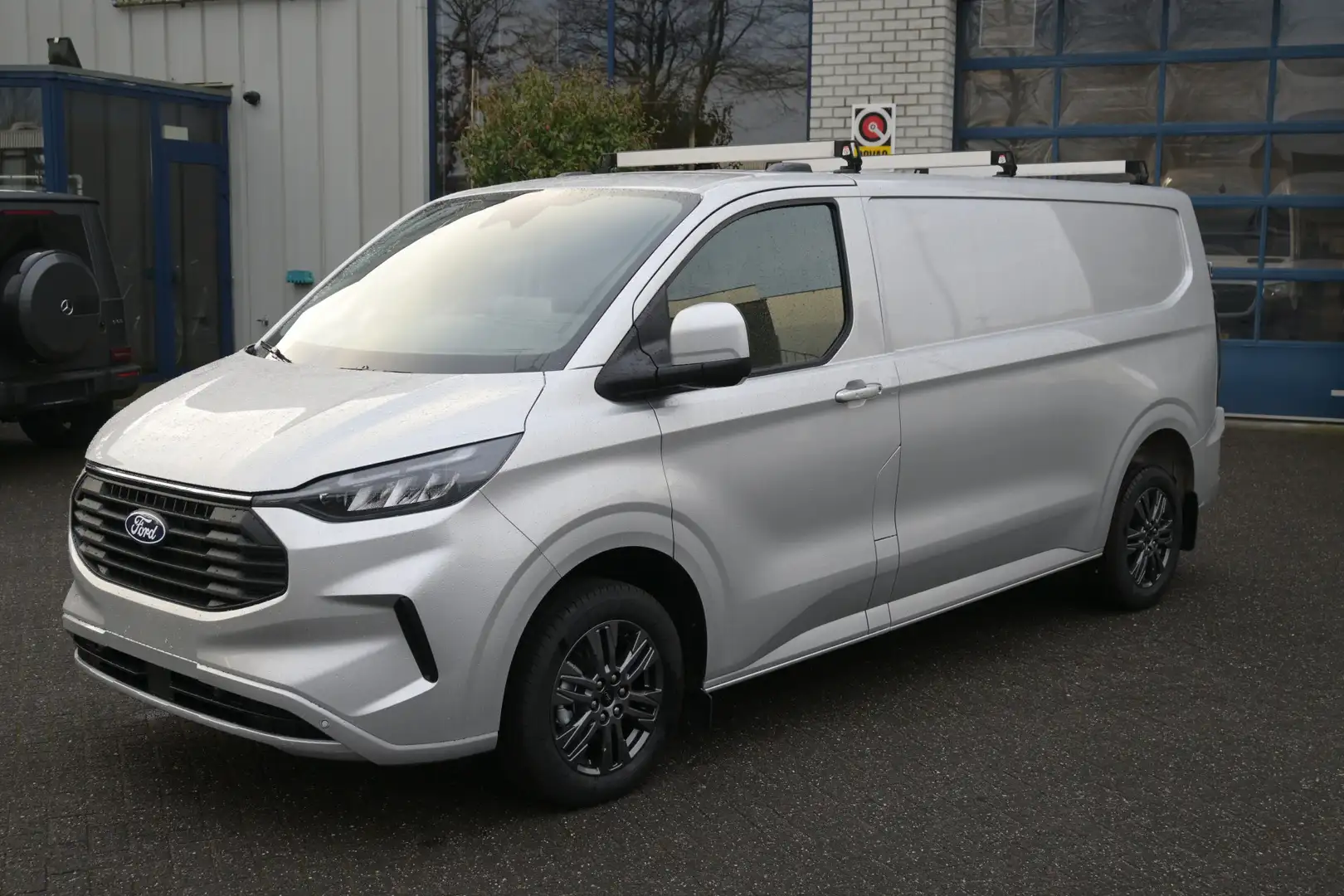 Ford Transit Custom 320L L2 2.0 TDCI 170 pk Limited Dakdragers, Trekha Argent - 1