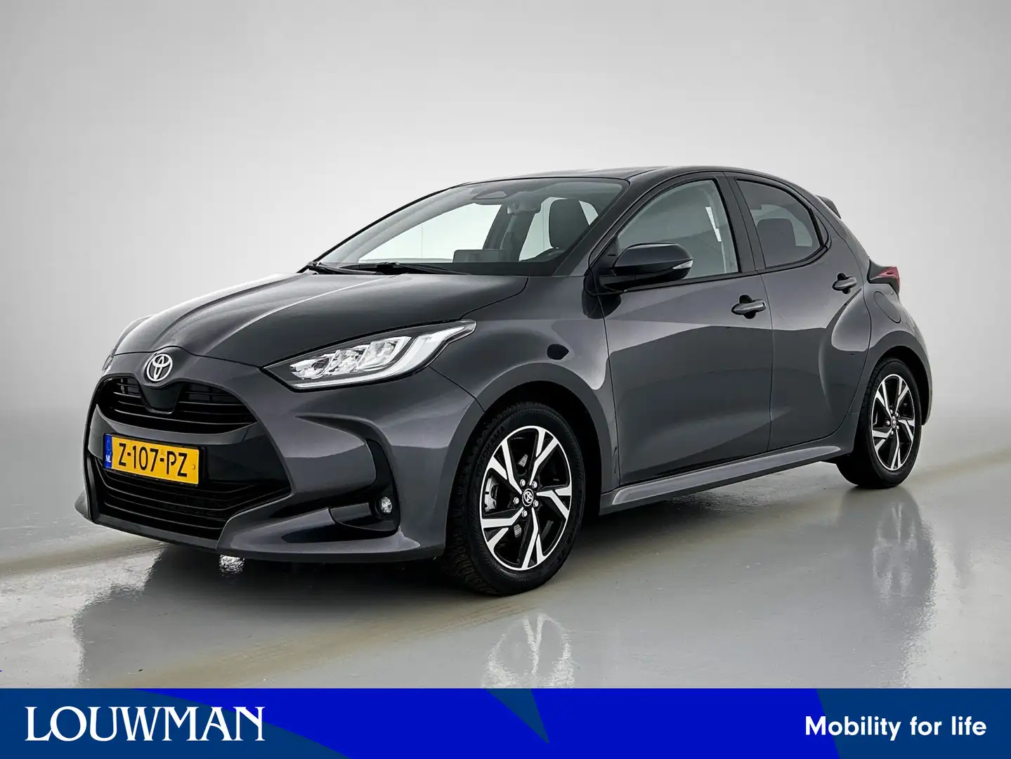 Toyota Yaris 1.5 Hybrid 115 First Edition 16'' LM velgen | Priv Grigio - 1