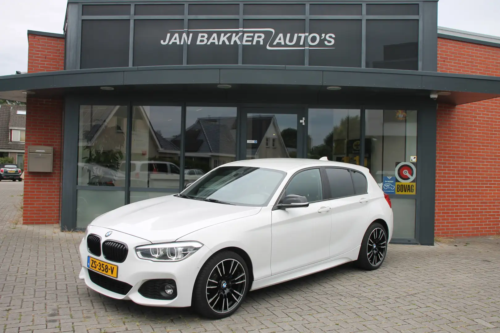BMW 118 1-serie 118i Executive ✅ Automaat ✅ Bluetooth ✅ M- Wit - 1