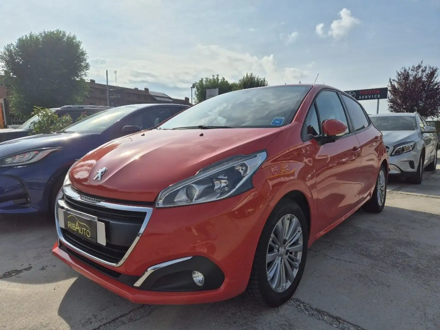 Peugeot 208 1° serie PureTech 82 5 porte Allure Arancione - 1