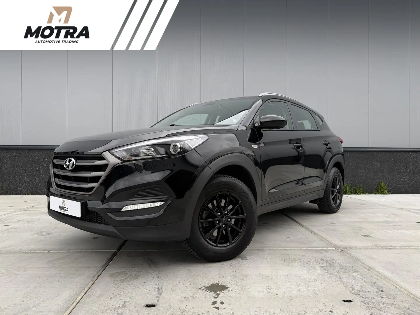 Hyundai TUCSON 1.6 GDi Premium | Trekhaak | Navigatie | PDC | Sto Zwart - 1