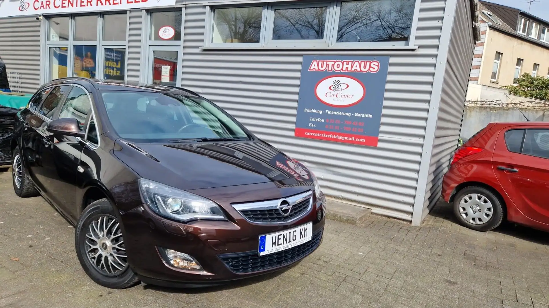 Opel Astra J 1.4 Sports Tourer Design Edition Bruin - 1