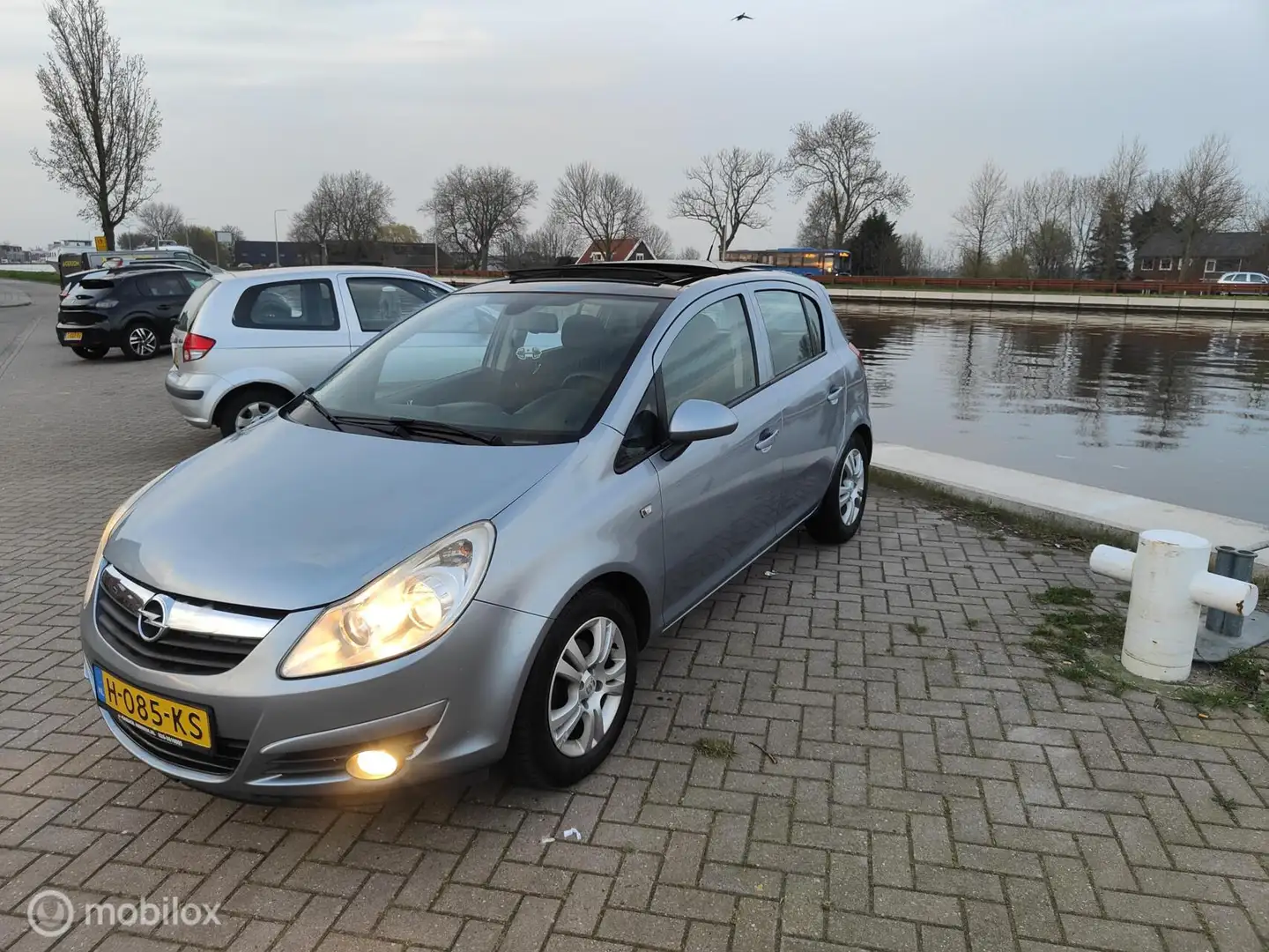 Opel Corsa 1.2-16V Selection PANORAMA DAK, APK,AIRCO,LM VELG Gris - 1