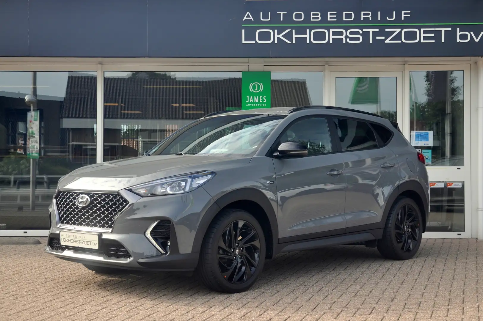 Hyundai TUCSON 1.6 T-GDI N-Line 177 PK | Camera | Trekhaak | Mooi Gris - 1