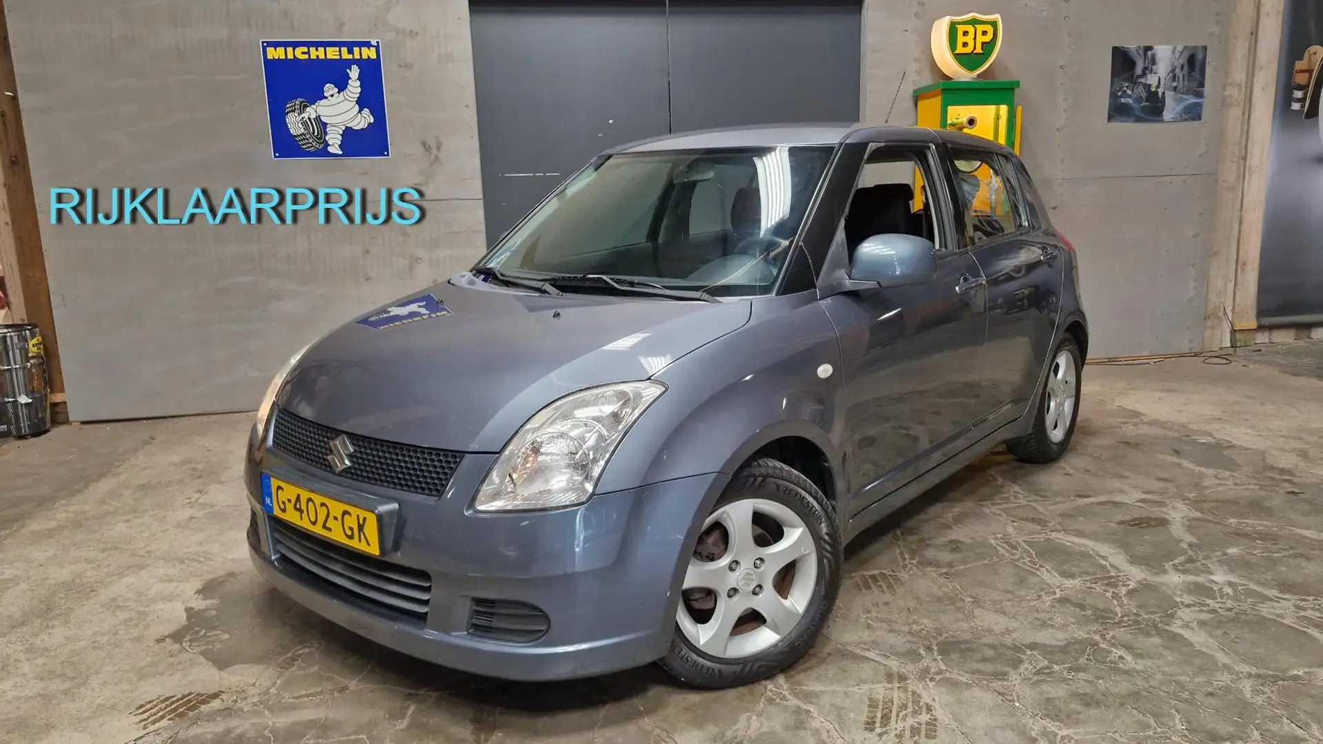 Suzuki Swift 1.3 GA 93PK | Rijklaarprijs | Airco | LMV Grau - 1