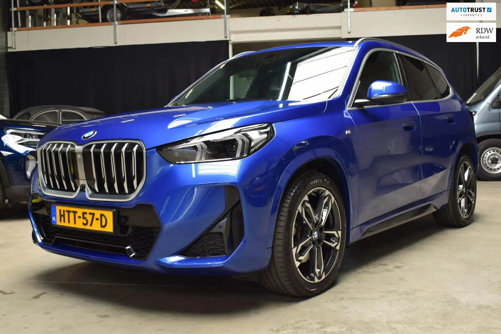 BMW X1 SDrive20i M Sport Pack vol stoelmassage/trekhaak Blauw - 1