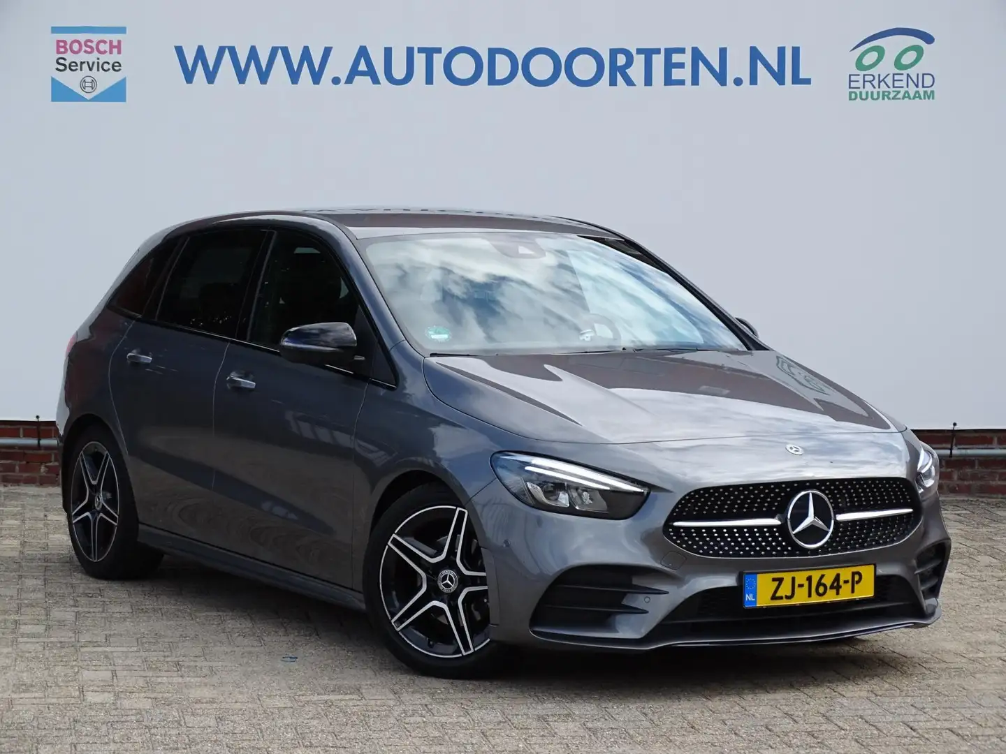 Mercedes-Benz B 180 Business Solution AMG|Stoelverwarming|Camera|Elek. Grijs - 1