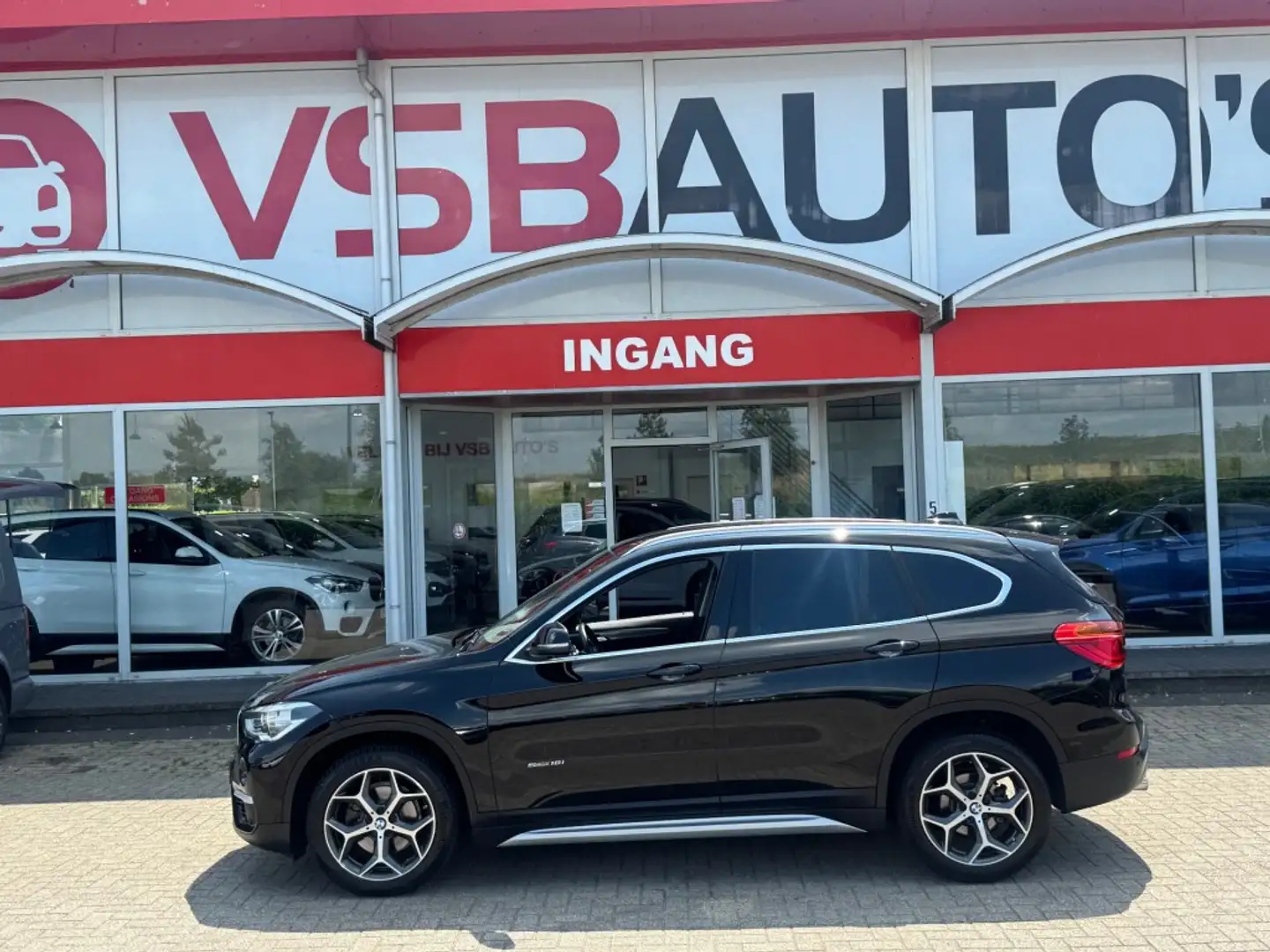 BMW X1 S-DRIVE 1.8 AUT. EXECUTIVE HALF-LEER NAVI AIRCO LM Zwart - 2