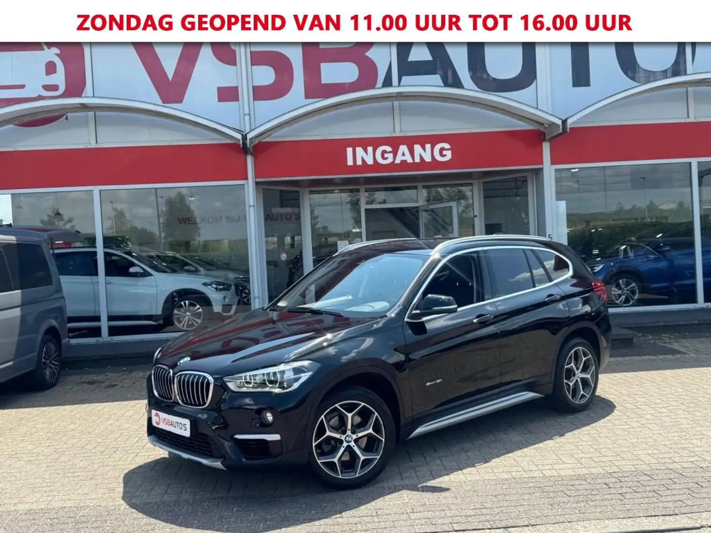 BMW X1 S-DRIVE 1.8 AUT. EXECUTIVE HALF-LEER NAVI AIRCO LM Zwart - 1
