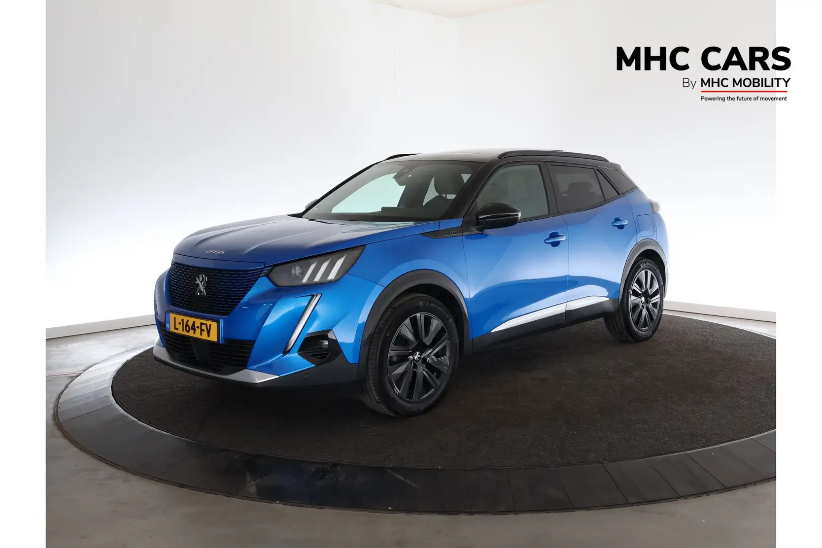 Peugeot e-2008 EV GT Première | SoH 100% | Panoramadak | Camera | Bleu - 1