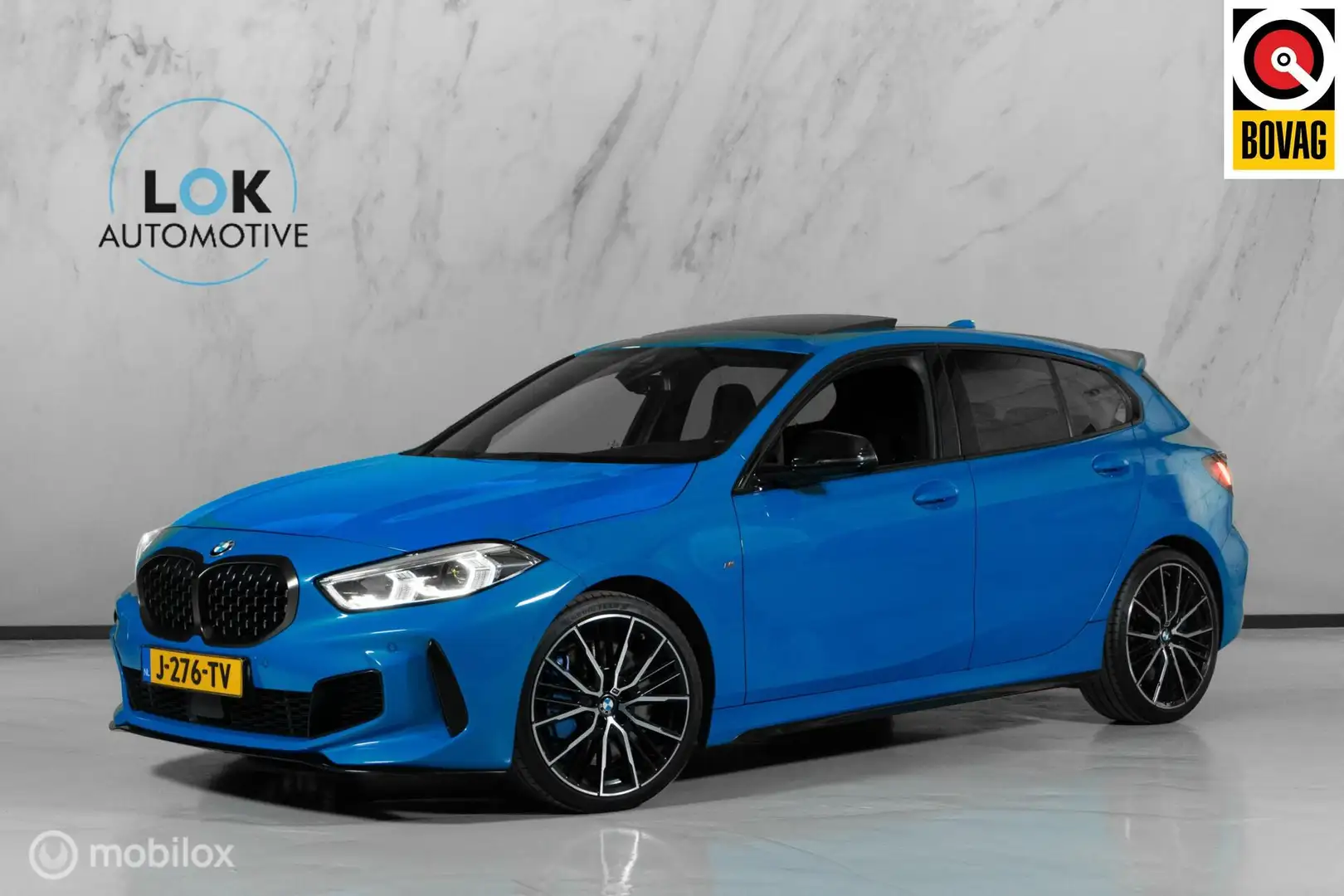 BMW 135 1-serie M135i xDrive High Executive|PANO|H&K|CAMER Blauw - 1