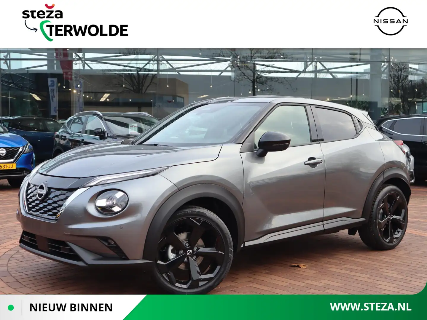 Nissan Juke 1.6 Hybrid Tekna | Lederen Bekl. | BOSE Audio | Ad Grijs - 1