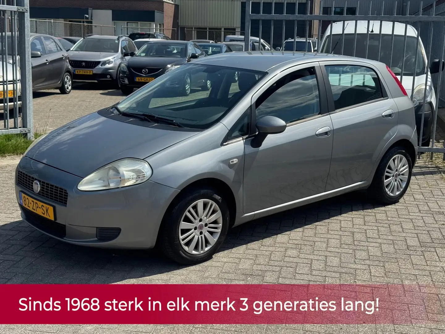 Fiat Grande Punto 1.4 Dynamic 5 deurs! NL AUTO NAP! Airco l CRUISE l Gris - 1