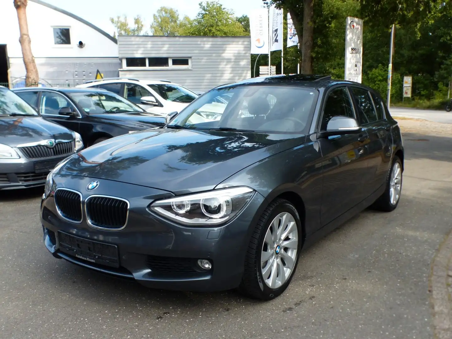 BMW 118 i Lim. Automatik SDach Xenon PTS Alu Shz SHft Gris - 1