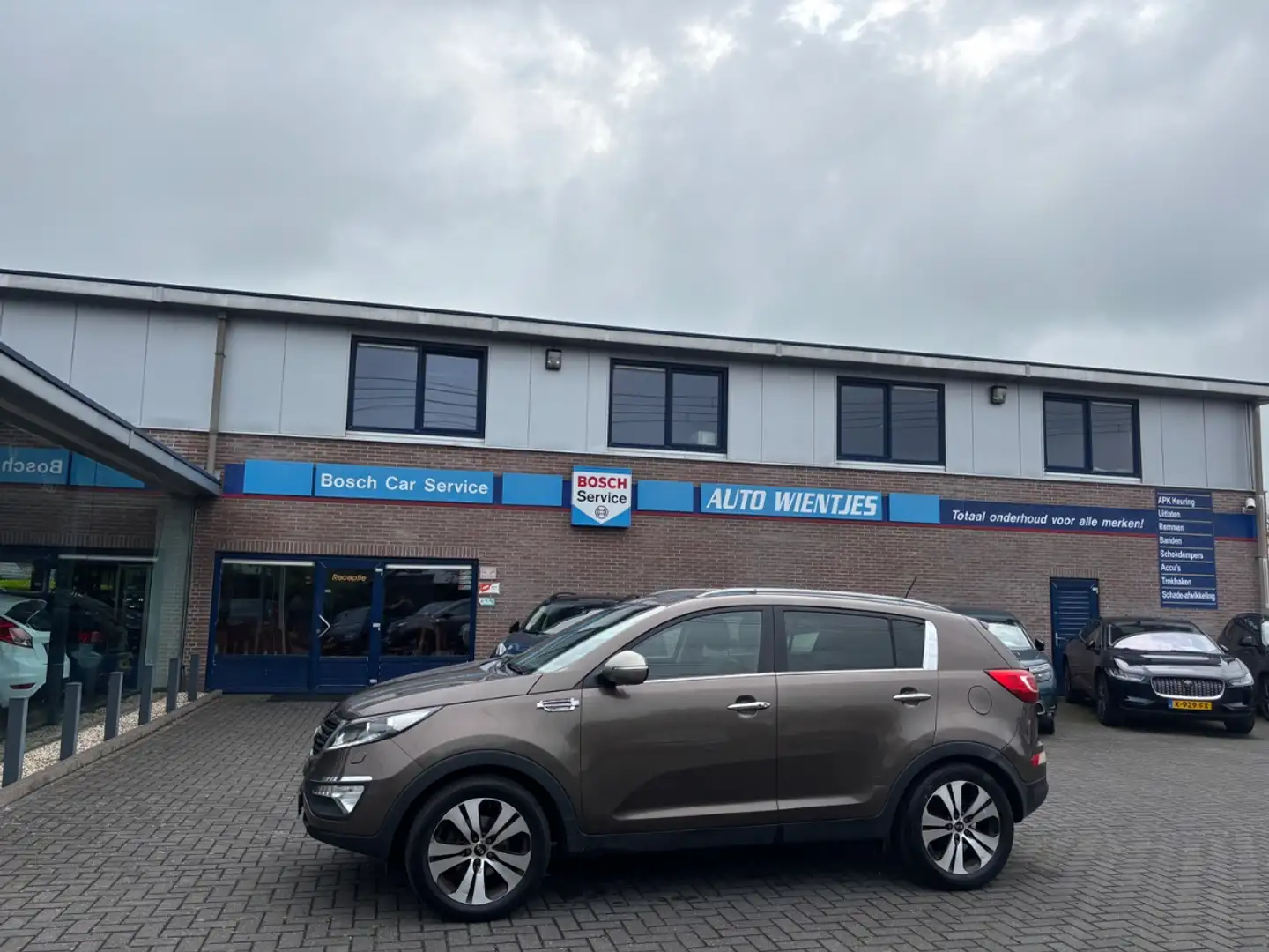 Kia Sportage 1.7 CRDI 85kw | X-clusive | Leer | Navi Marrón - 1