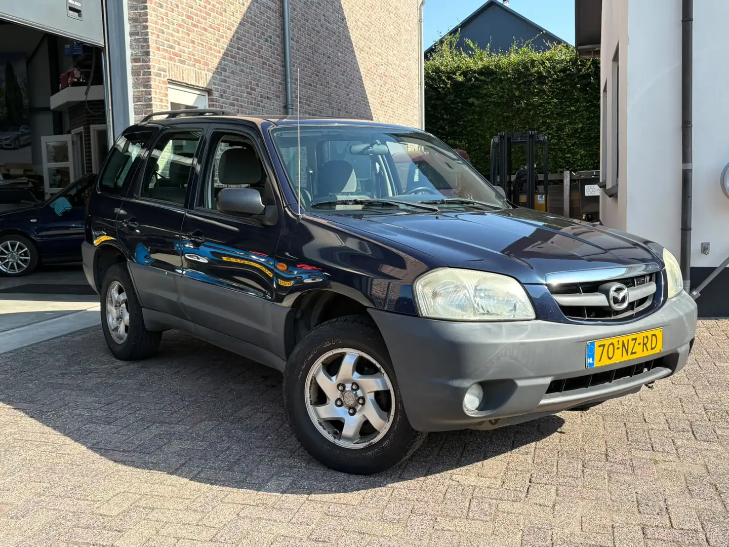 Mazda Tribute 2.0 Exclusive 4WD Airco inruilkoopje Blau - 1