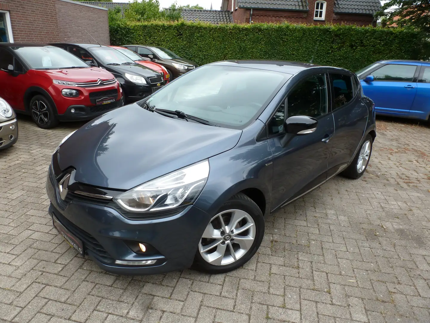 Renault Clio Limited 1.2 Airco Bluetooth Navigatie Pdc 1e Eig!! Blauw - 1
