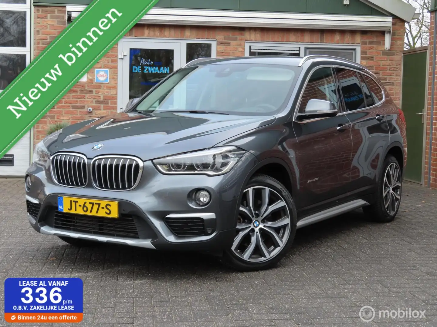 BMW X1 sDrive20i High Executive|Sportleer|Camera|Carplay| Grijs - 1