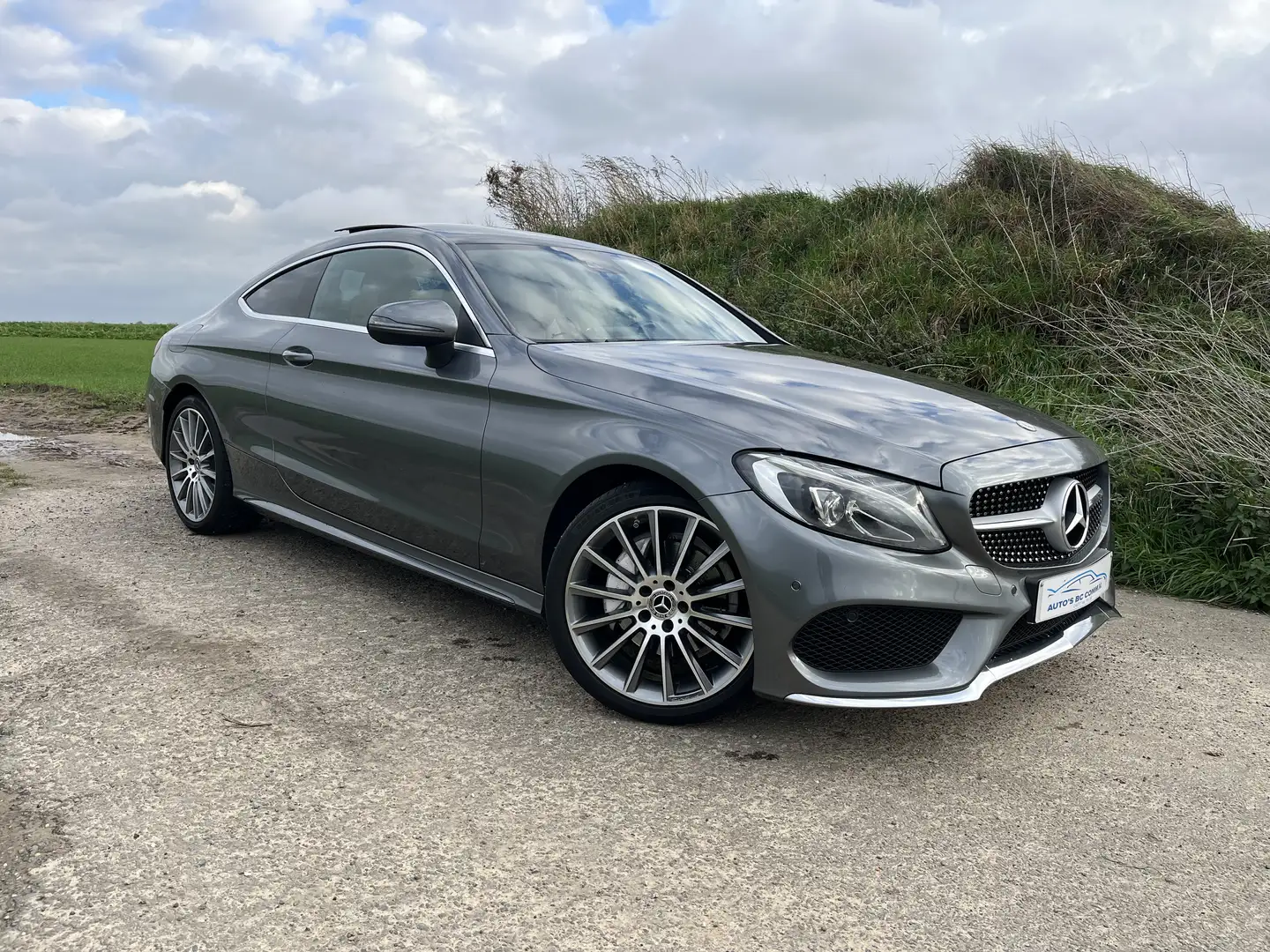 Mercedes-Benz C 200 C 200 Coupe AMG Line*PANO* 1 ST EIGENAAR Grijs - 1