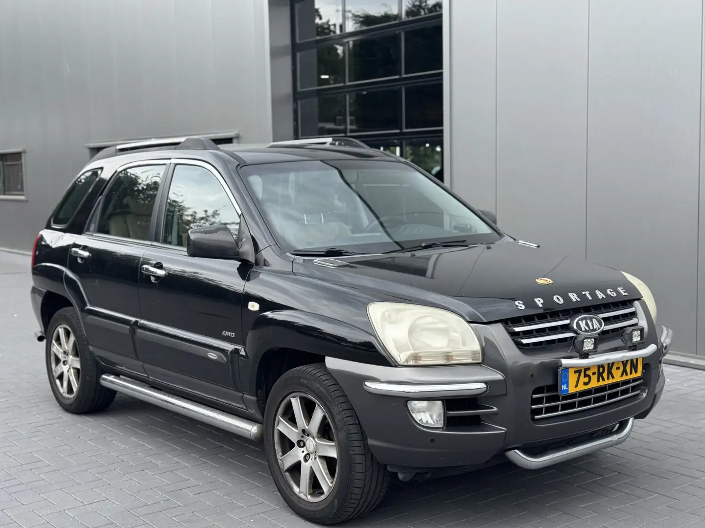 Kia Sportage 2.7 V6 Adventure 4WD | Leder | Automaat Zwart - 1