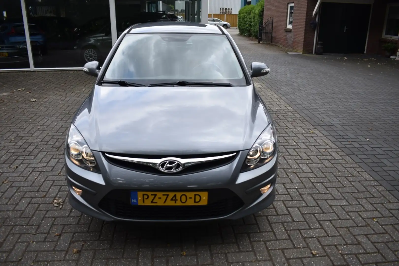 Hyundai i30 1.4i i-Motion CRUISE CLIMA PDC TREKHAAK Grijs - 2