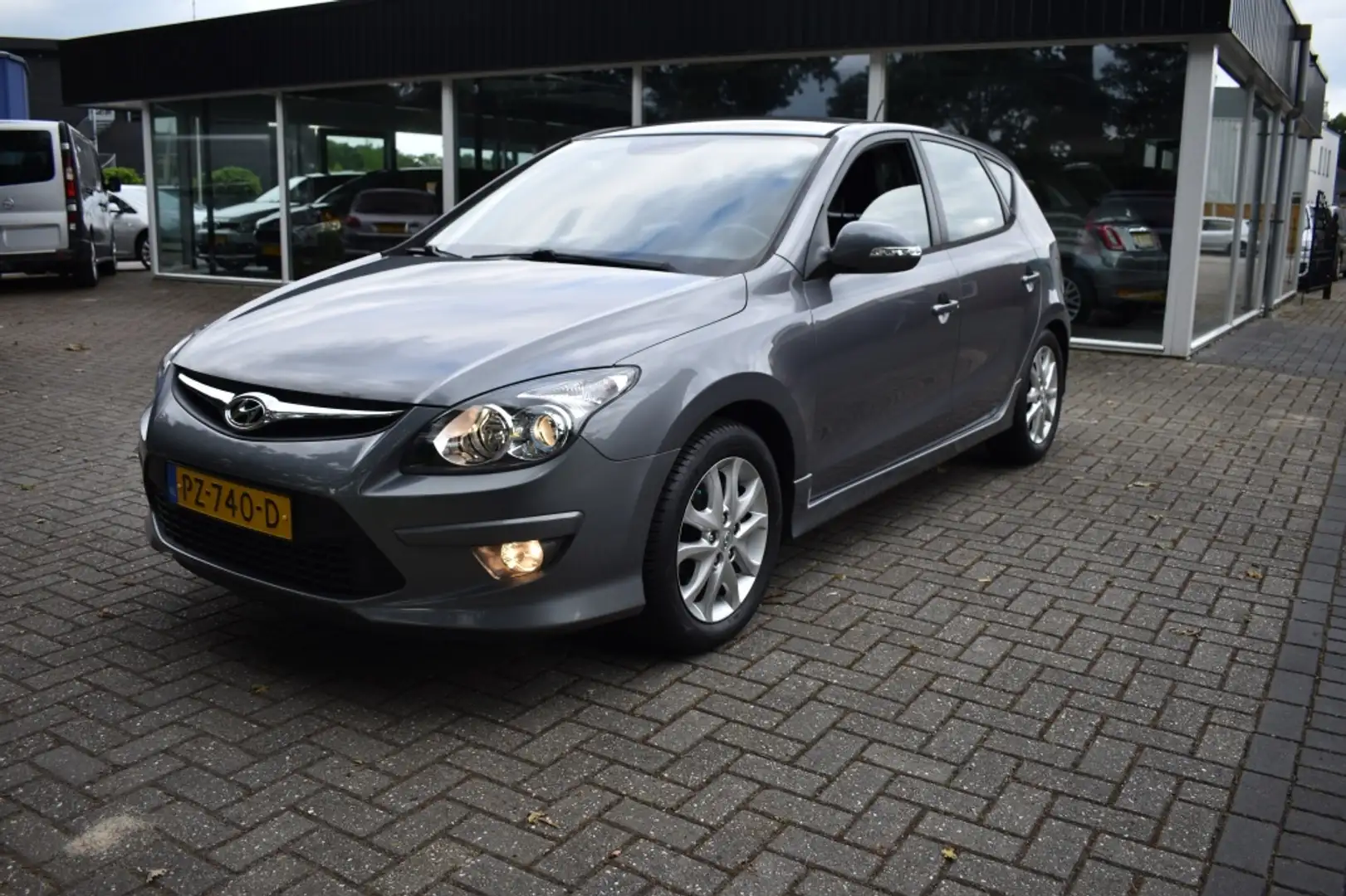 Hyundai i30 1.4i i-Motion CRUISE CLIMA PDC TREKHAAK Grijs - 1