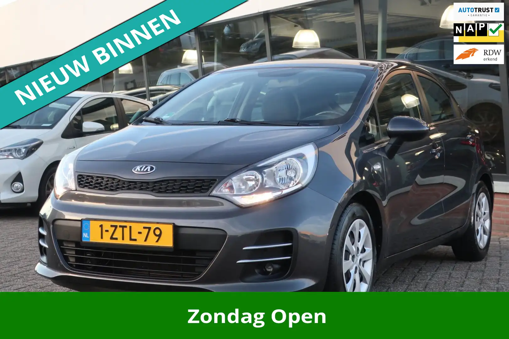 Kia Rio 1.2 CVVT ComfortLine 2e EIG_AIRCO_CRUIS_DOH_NAP. Gris - 1