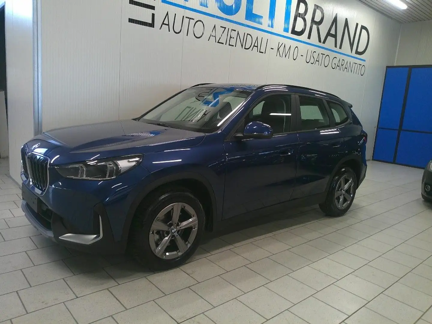 BMW X1 sDrive 18i Aut. Navi Telecamera Led Garanzia 24M Blauw - 1