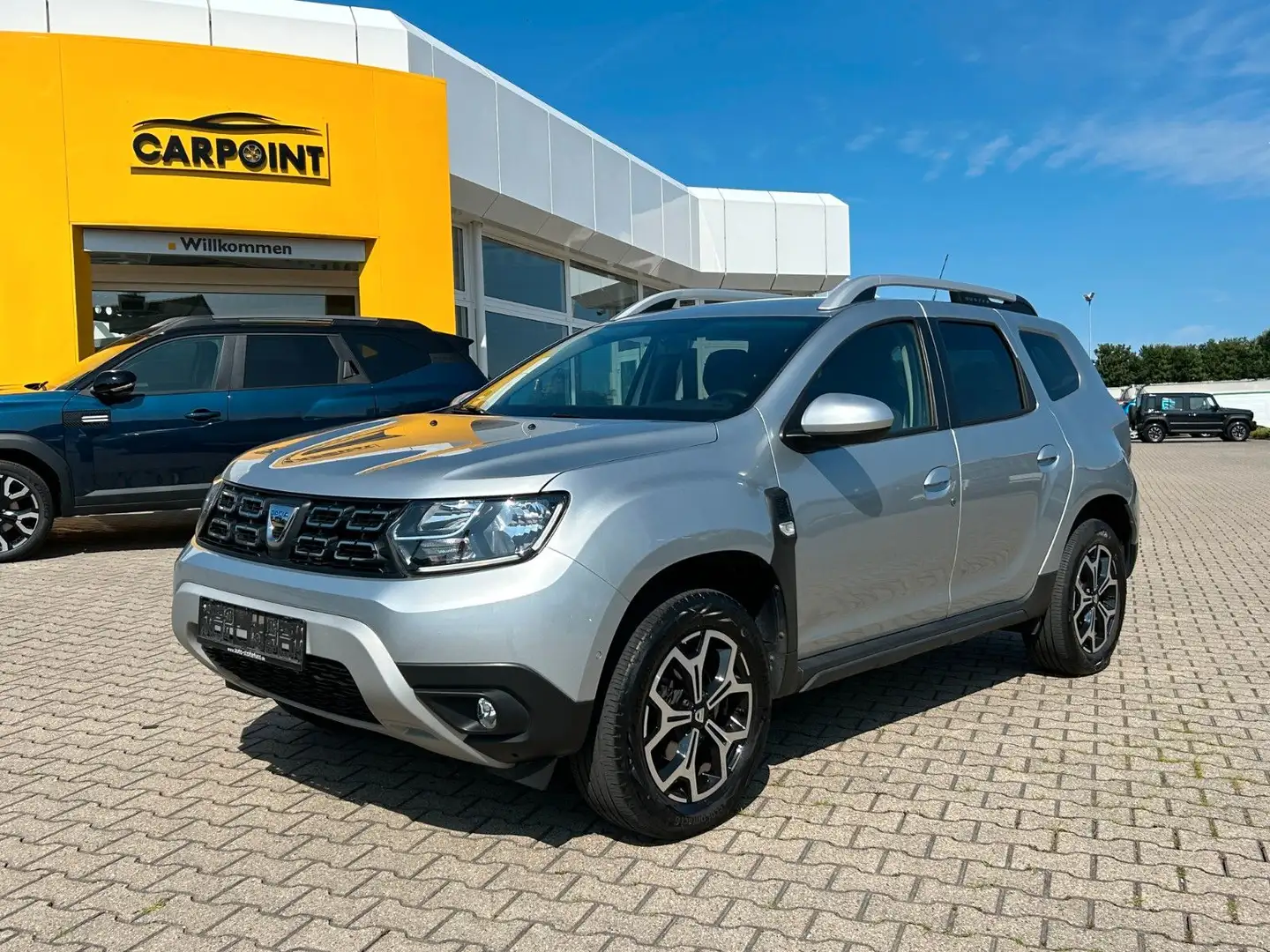 Dacia Duster II Prestige TCe 100 ECO-G Kamera Navi PDC Grau - 1