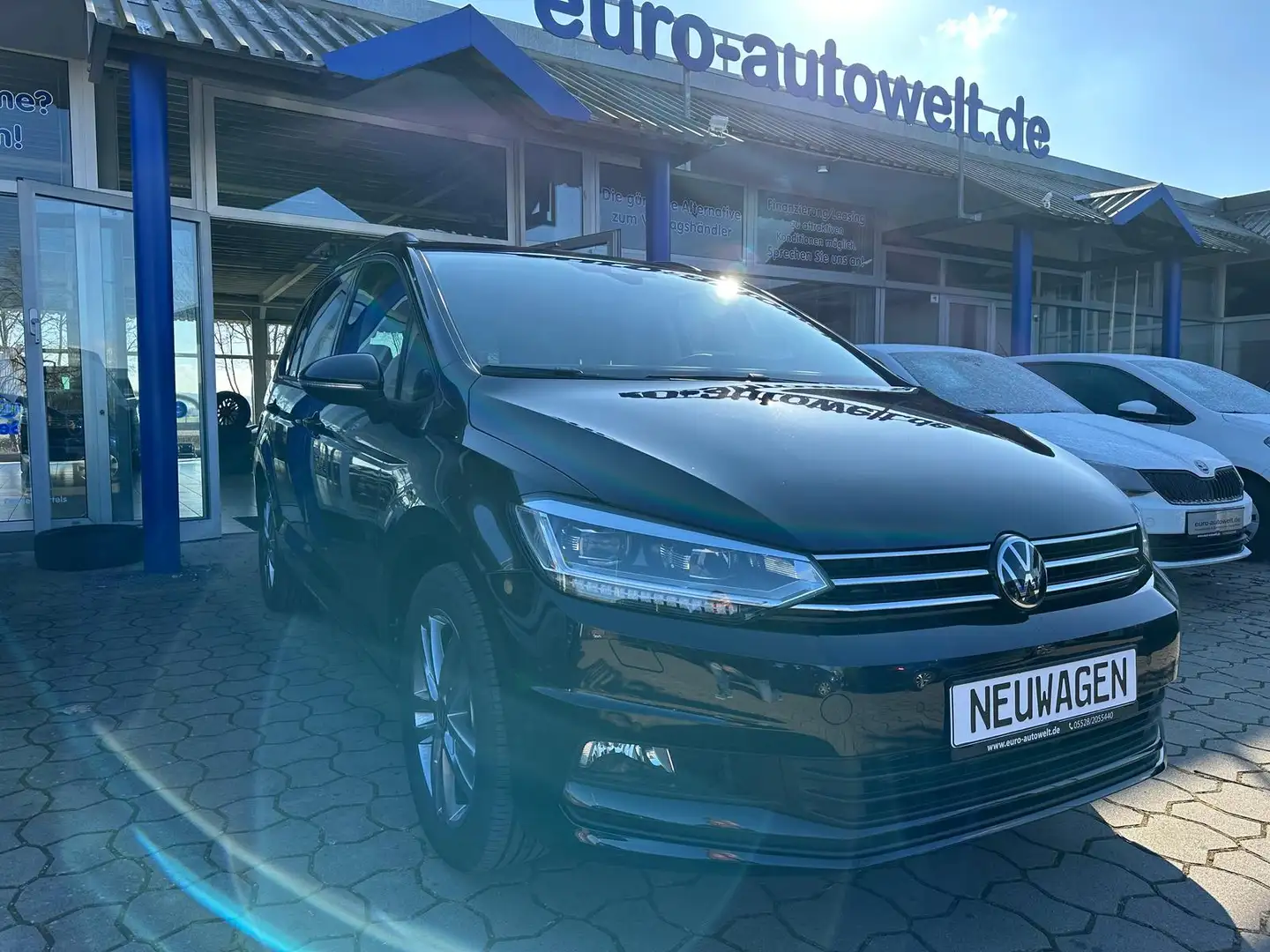 Volkswagen Touran 1.5TSI DSG Com. *AHK*Navi*el.HK*7Sitzer Schwarz - 1